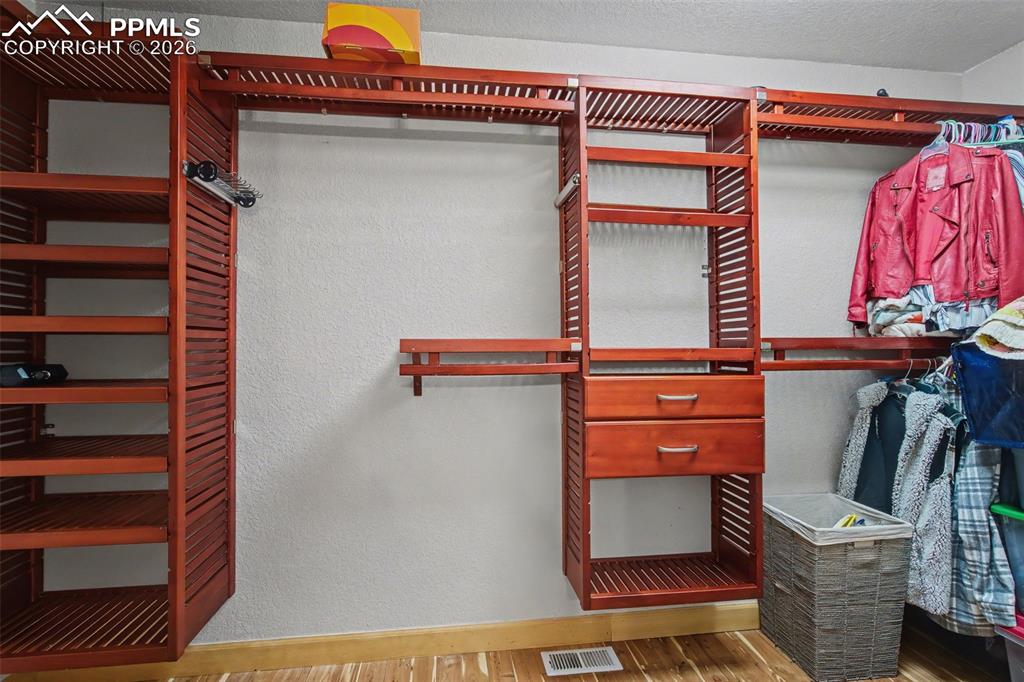 Image 23 of 42: Primary closet