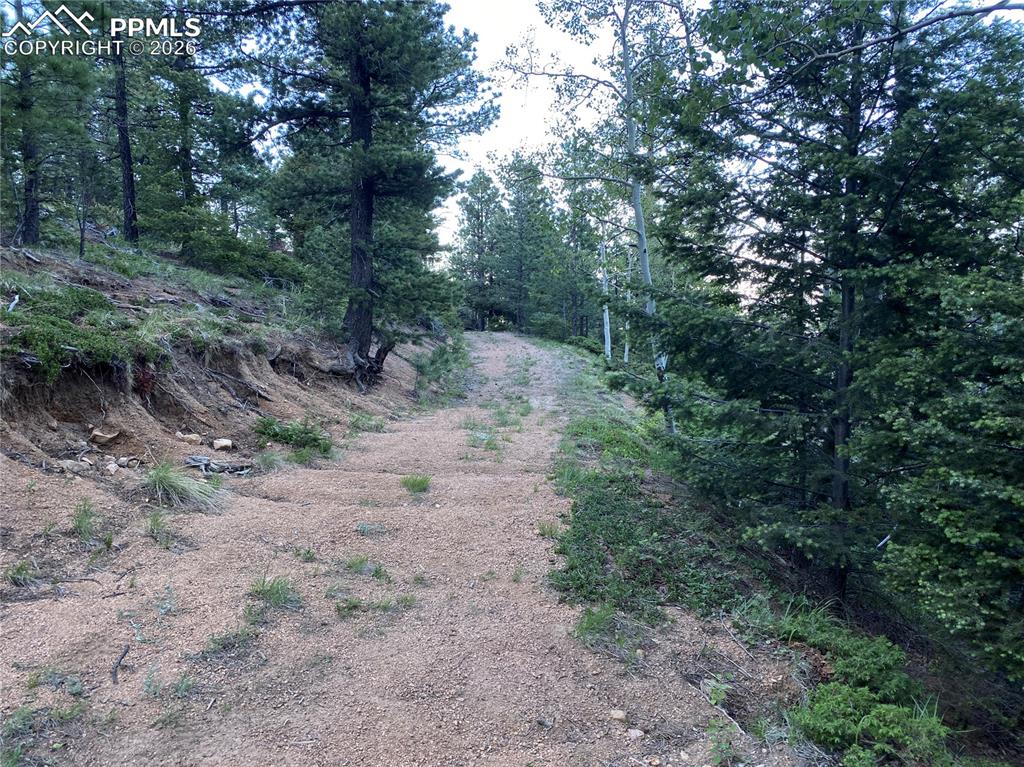 Image 9 of 17: Build site looks at Colorado Springs Down below! Derby Rock is the formatio