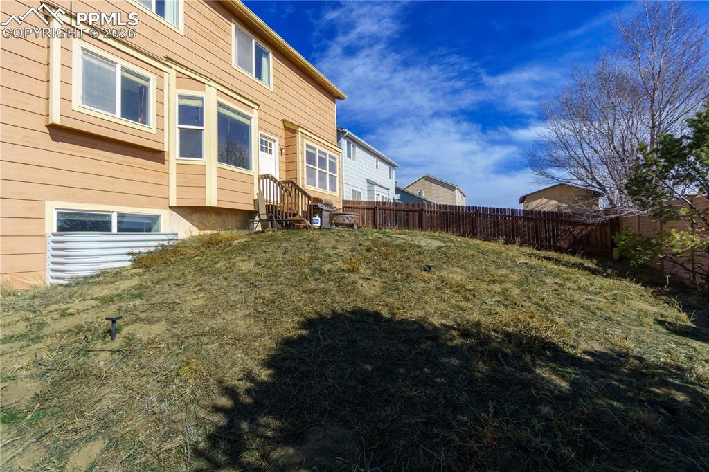 Image 38 of 40: View of fenced backyard