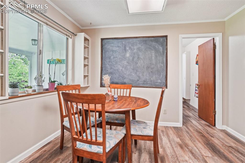 Image 10 of 49: Dining room adjoins the kitchen with access to the laundry area and garage