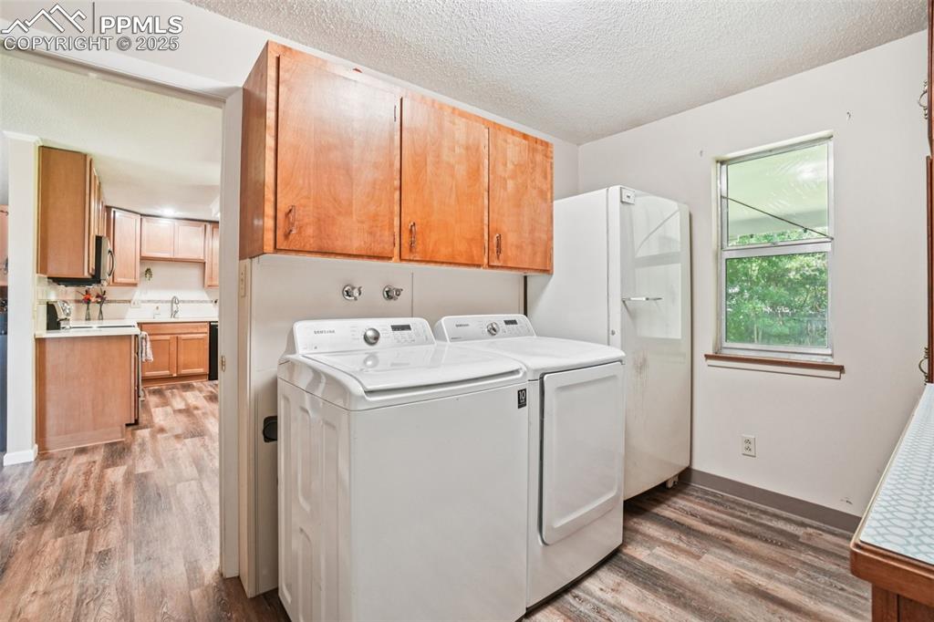Image 26 of 49: Laundry room/mud room main level with direct access to the garage!