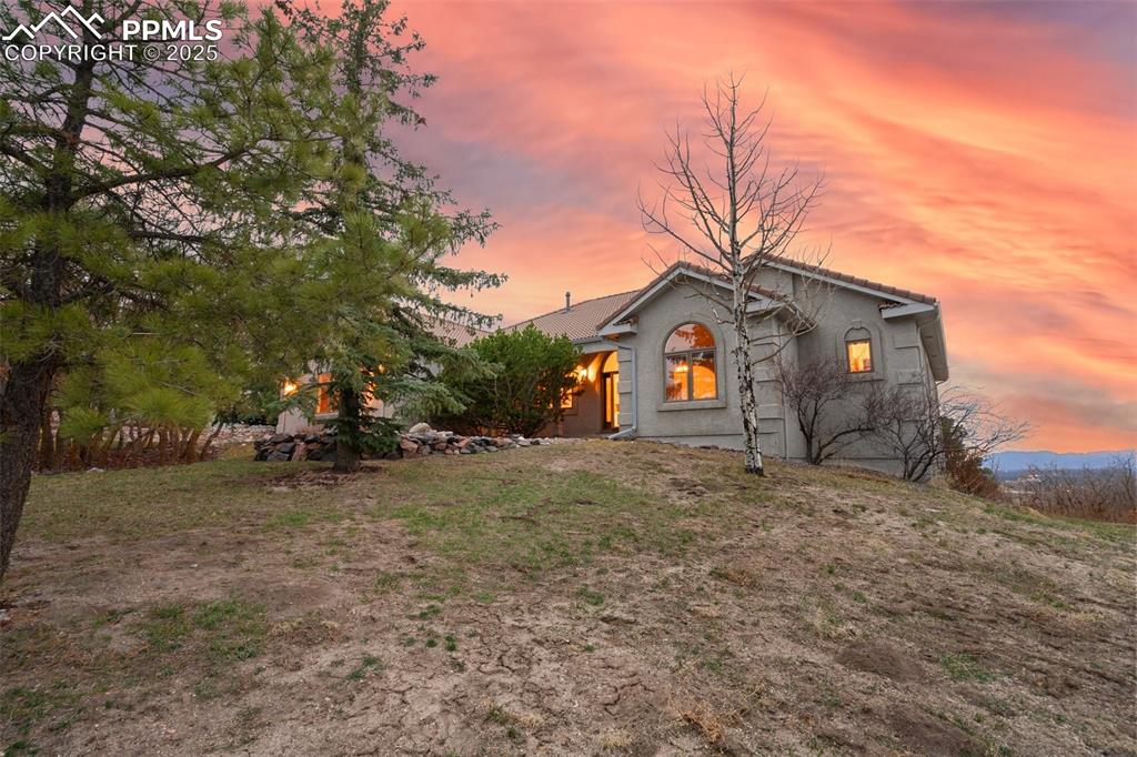 Image 3 of 48: View of front of home with stucco siding