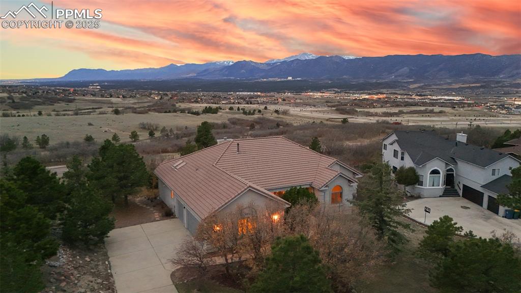 Image 4 of 48: Aerial view at dusk with a mountain view