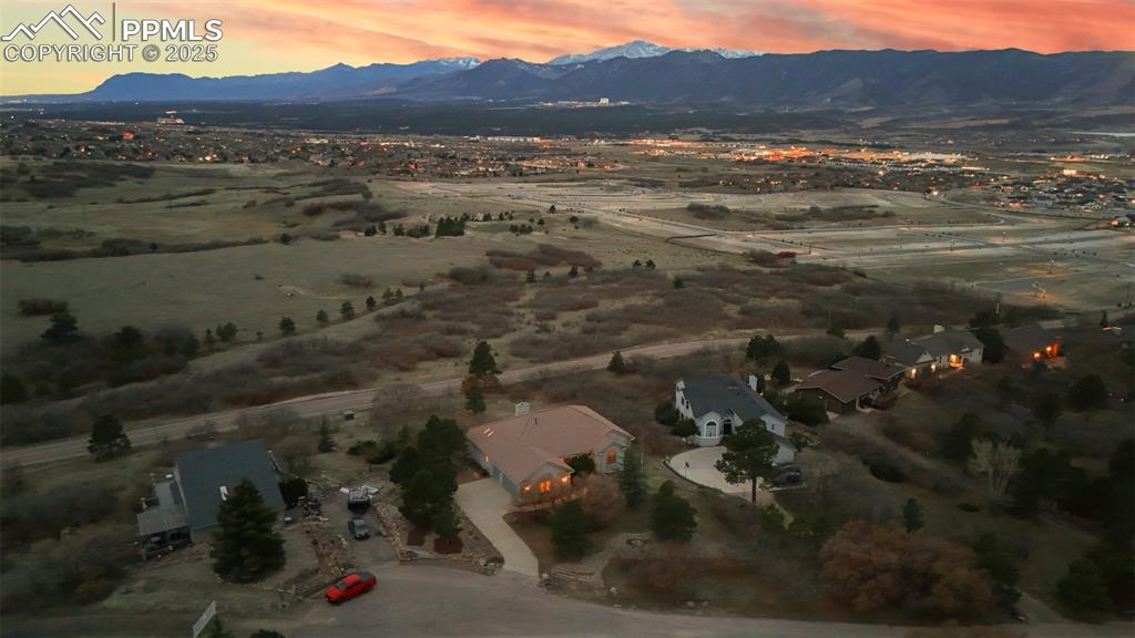 Image 48 of 48: Aerial view at dusk featuring a mountain view