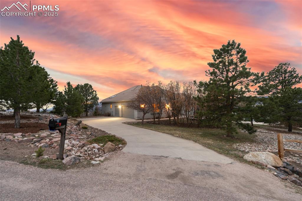 Image 7 of 48: View of front facade with driveway