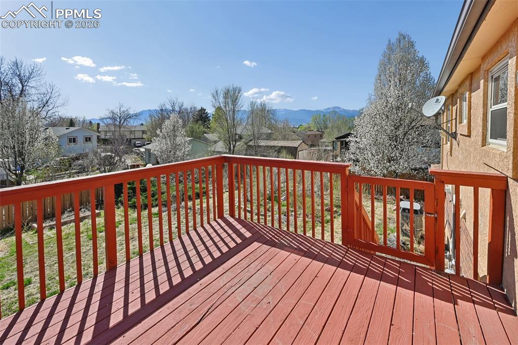 Image 22 of 25: Deck with a residential view and a mountain view