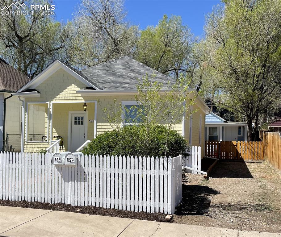 Image 1 of 30: Newly Painted House and Cottage - Both with new roofs and gutters.