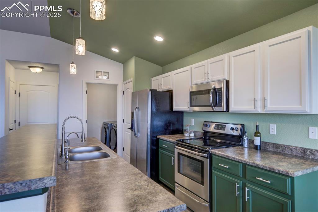 Image 10 of 45: Kitchen featuring stainless steel appliances, newly painted cabinets, new p