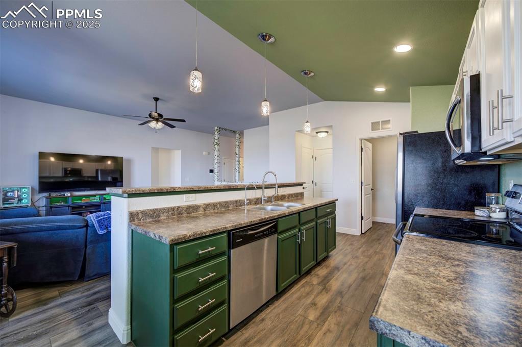 Image 11 of 45: Kitchen featuring stainless steel appliances, newly painted cabinets, new p