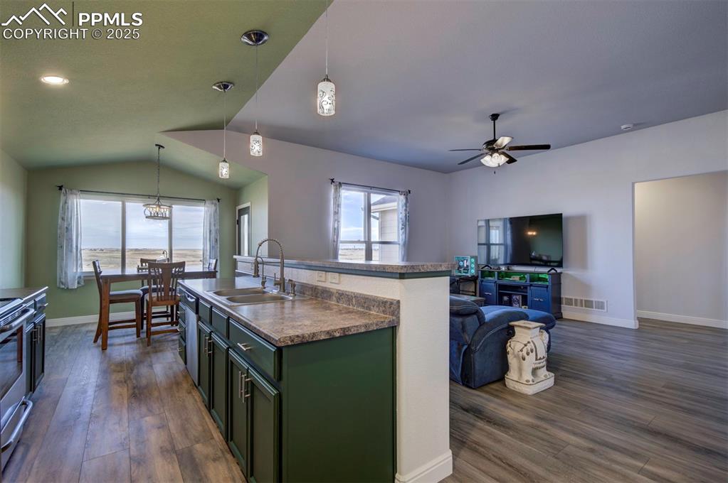 Image 12 of 45: View of open concept of kitchen, dinning and living room.