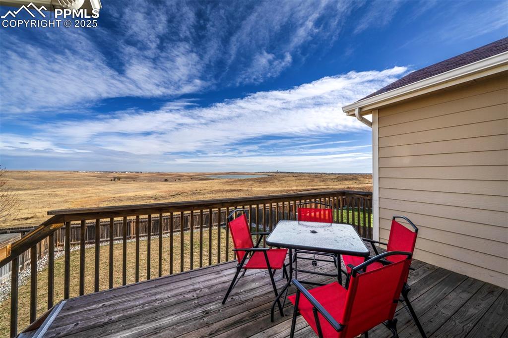 Image 15 of 45: Wooden deck featuring views of Big Johnson Reservoir.