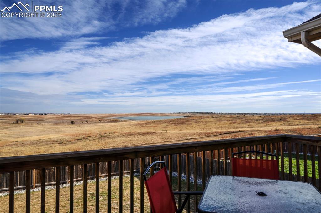 Image 16 of 45: Wooden deck featuring views of Big Johnson Reservoir.