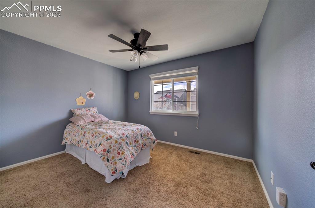 Image 21 of 45: Bedroom featuring carpet and ceiling fan