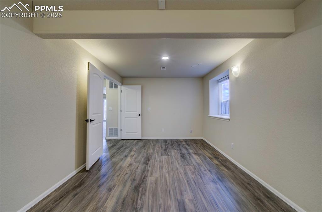 Image 35 of 45: Bedroom in basement with luxury vinyl flooring, recessed lighting, and larg