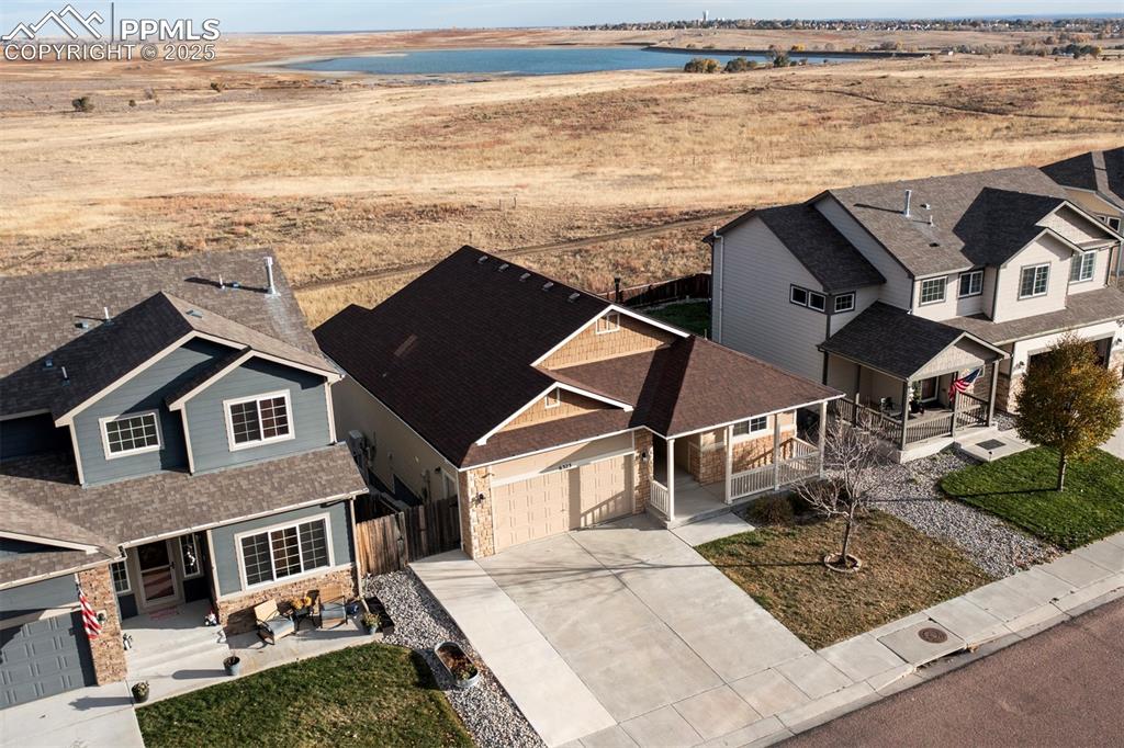 Image 4 of 45: View of home, open space with beautiful view of Big Johnson Reservoir.