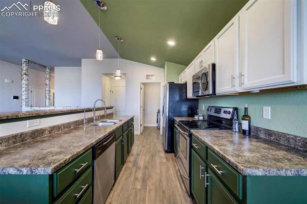 Image 8 of 45: Kitchen featuring stainless steel appliances, newly painted cabinets, new p