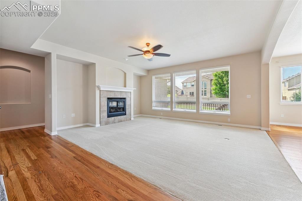 Image 17 of 46: Main floor living space with gas fireplace, tons of natural light, new carp