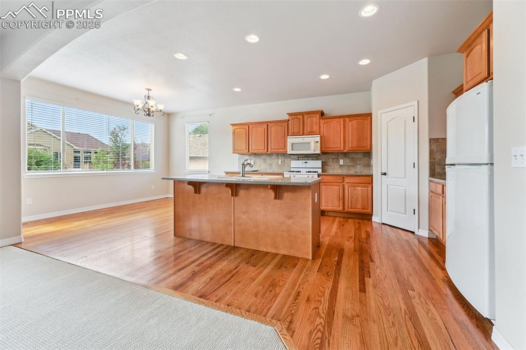 Image 19 of 46: Open floorplan kitchen/dining area with island