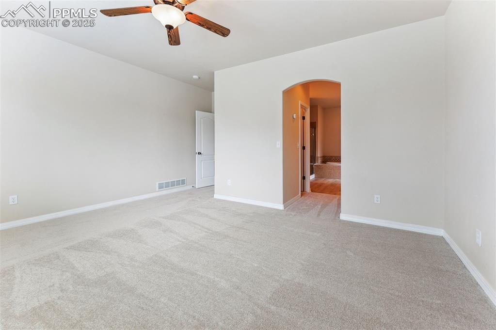 Image 26 of 46: Main level Master bathroom with ample natural light