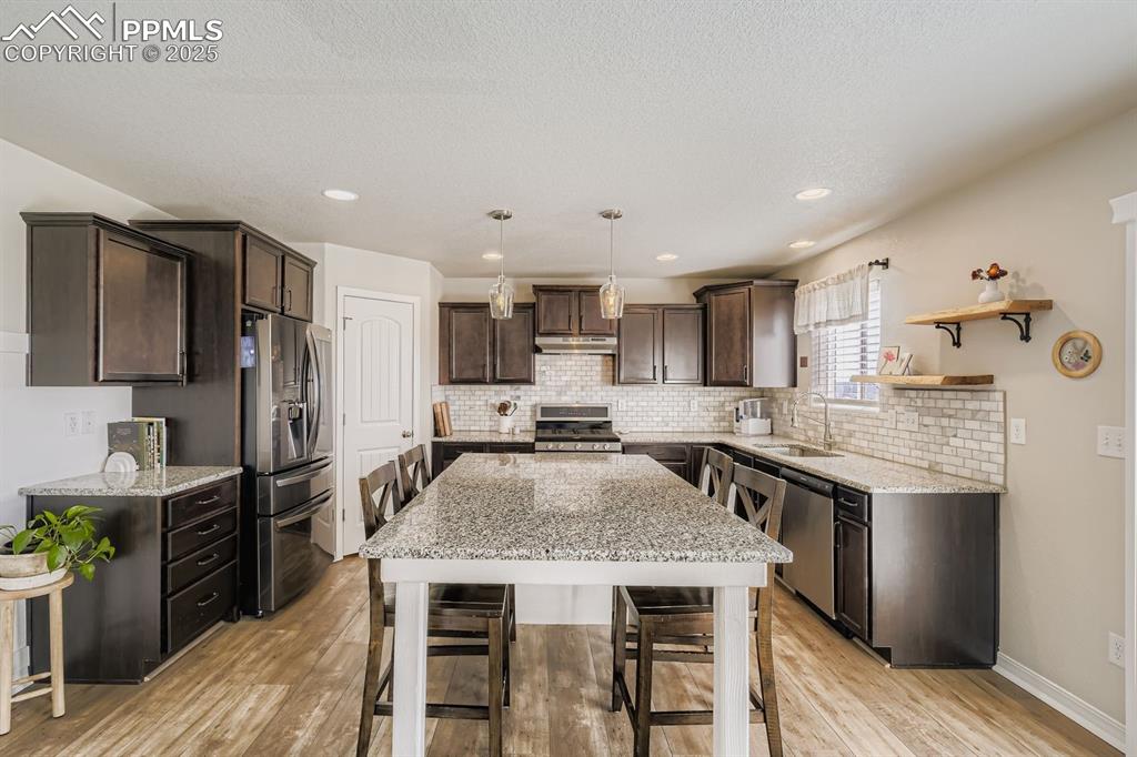 Image 12 of 42: All stainless steel appliances.