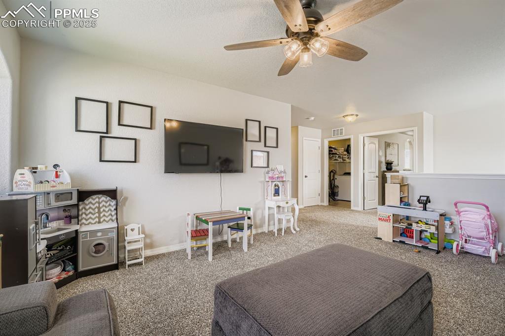 Image 23 of 42: Spacious loft allows for a play room or family room.