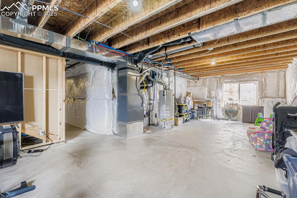 Image 25 of 42: Room to grow. Garden level basement with tall ceilings.
