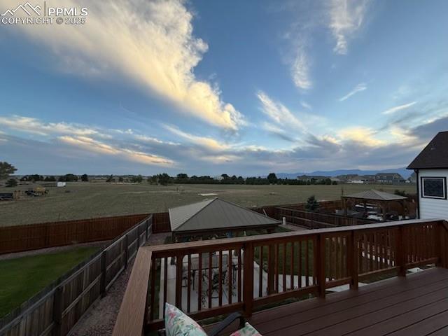 Image 42 of 42: Private lot behind the house creates a backyard oasis.