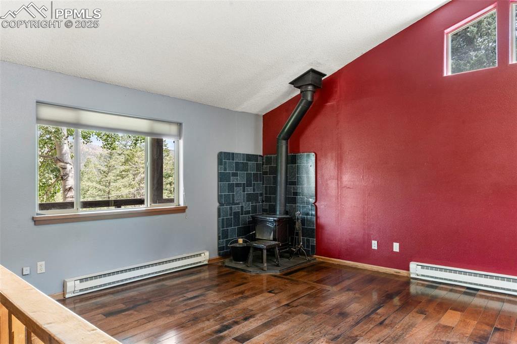 Image 11 of 30: Stand-Alone Fireplace in the Living Room