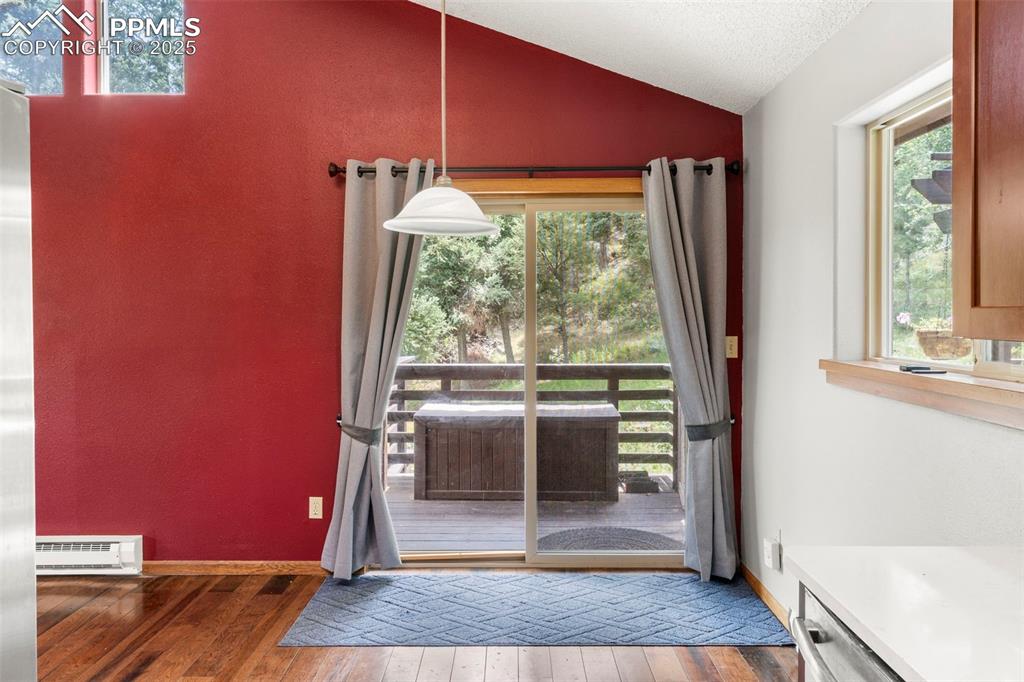 Image 13 of 30: Dining Area with a Vinyl, Sliding Glass Door