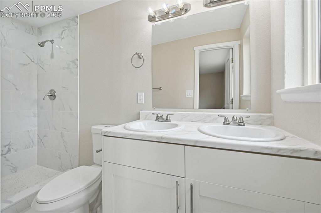 Image 16 of 36: Primary bathroom attached to the bedroom.