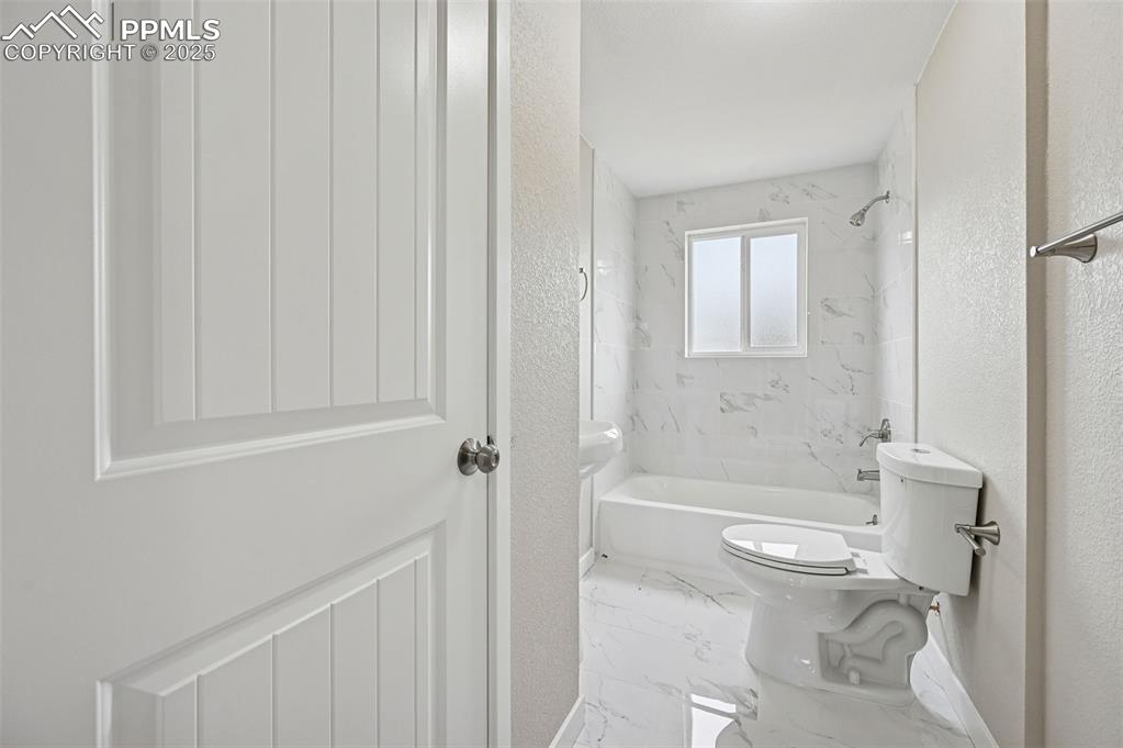 Image 20 of 36: Upper level full bathroom