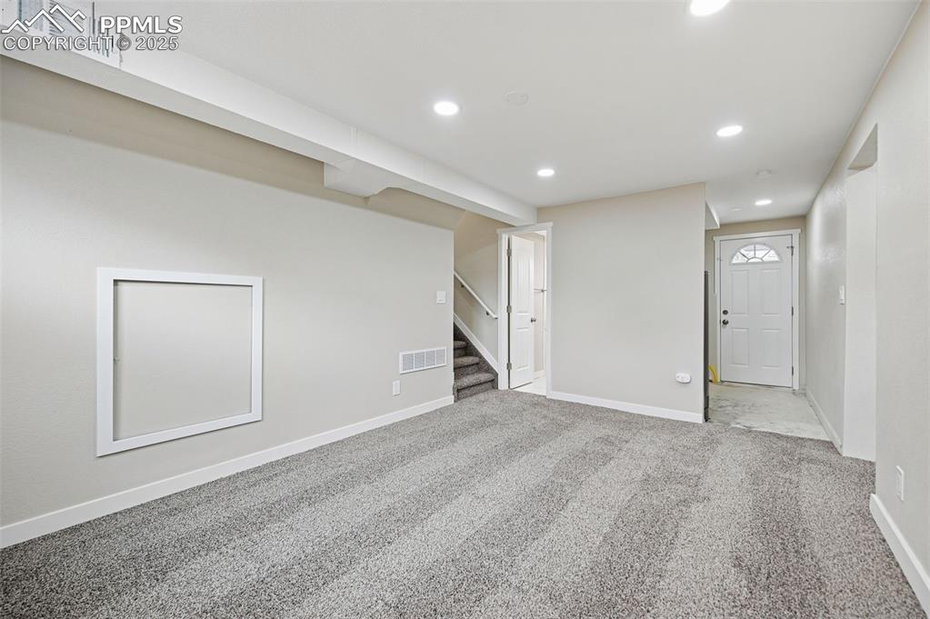 Image 23 of 36: Lower level family room