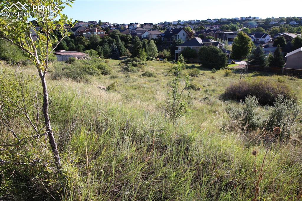 Image 8 of 9: View of property and surrounding suburban area.