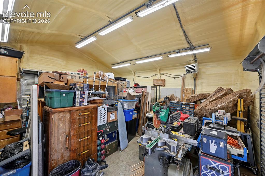 Image 47 of 50: Great shop with heat, LED lighting, and 2 overhead doors 9x7