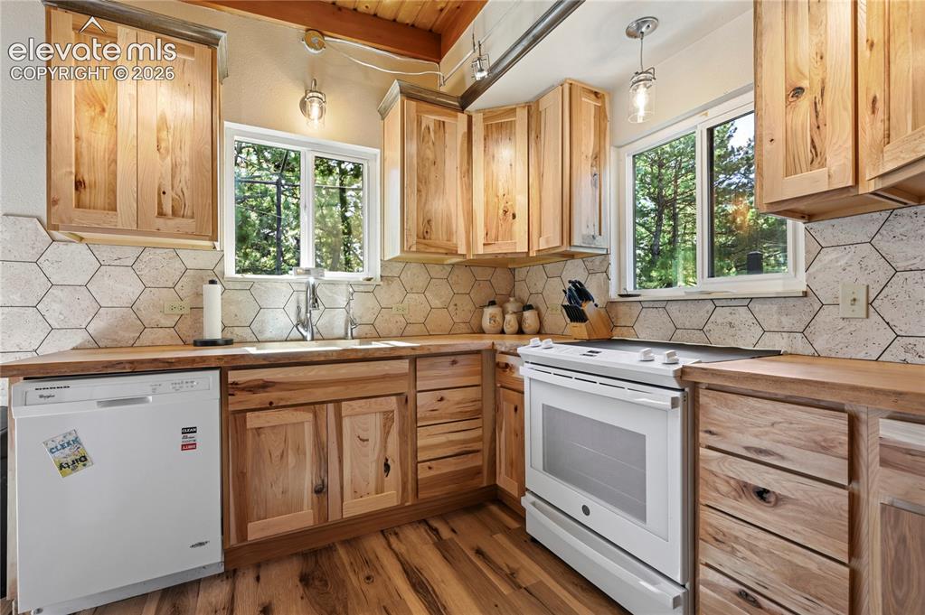 Image 5 of 50: Kitchen featuring wood-finish cabinetry, wood-finish countertops, hexagonal