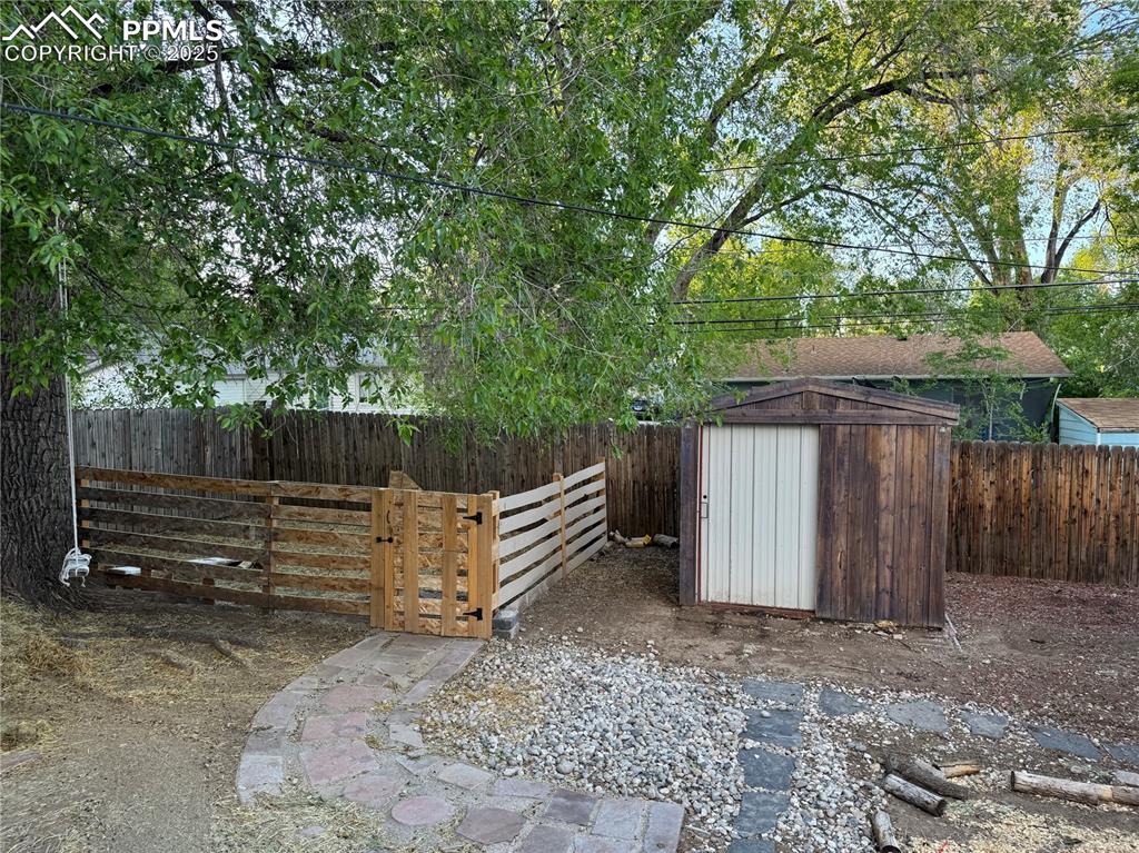 Image 25 of 25: View of fenced backyard