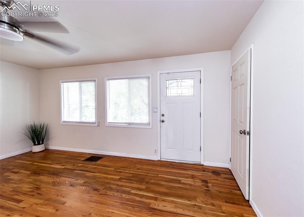 Image 4 of 25: featuring wood finished floors, healthy amount of natural light, and ceilin