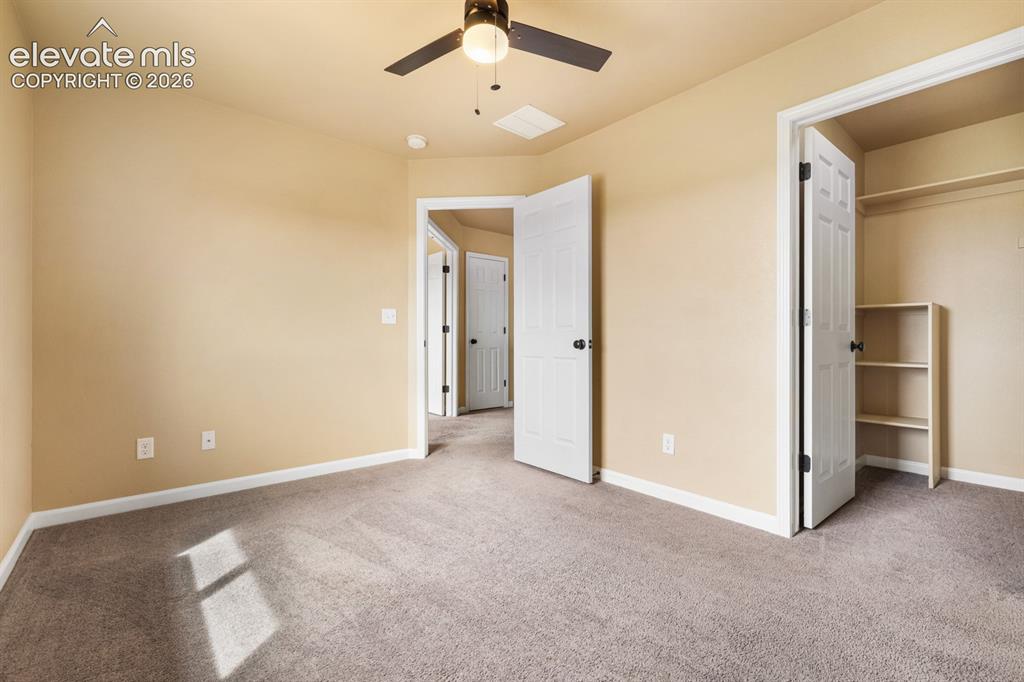 Image 28 of 50: Neutral-toned carpeting throughout the room