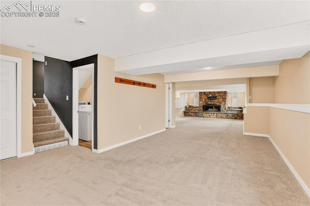 Image 16 of 37: Spacious lower level family room or flex space.
