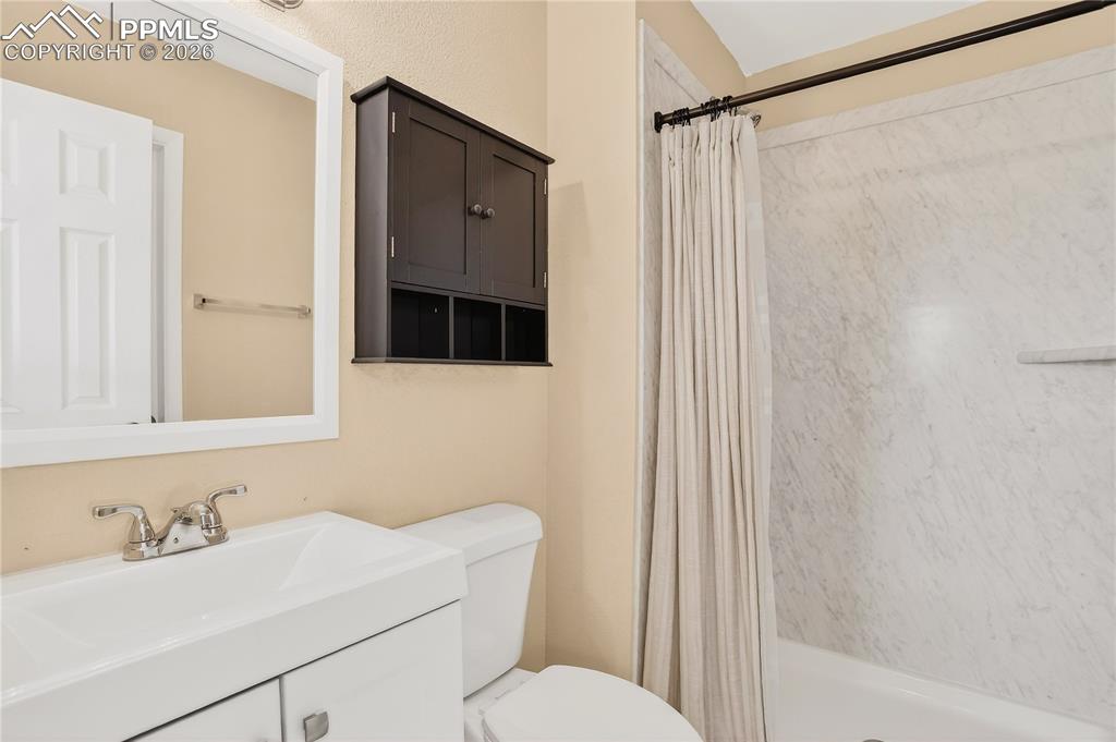 Image 25 of 37: Primary bathroom featuring an updated vanity and walk-in shower.