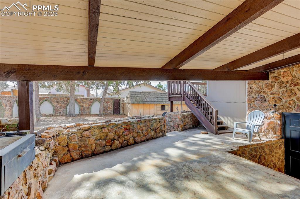 Image 35 of 37: Covered patio space designed for outdoor gatherings.
