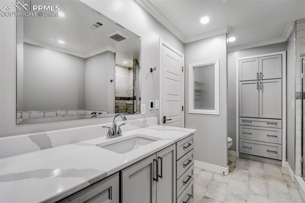 Image 32 of 39: Luxurious basement bath between the bedroms
