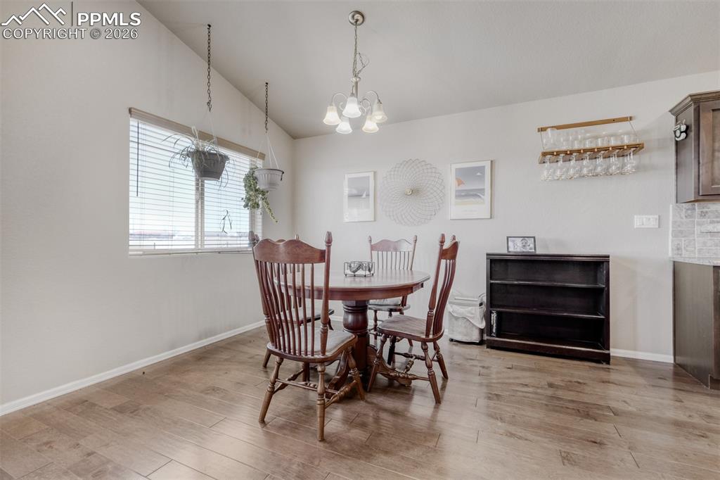 Image 9 of 39: Eating area is sunny and bright