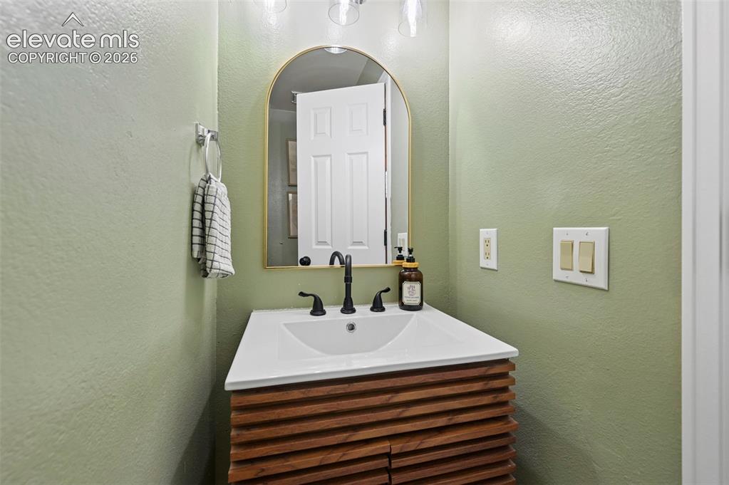 Image 17 of 48: Main level guest bathroom