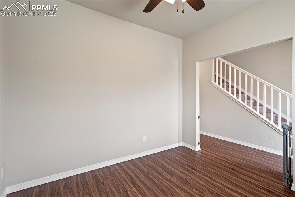 Image 17 of 46: Interior space featuring wood-finish flooring, light neutral wall tones, wh