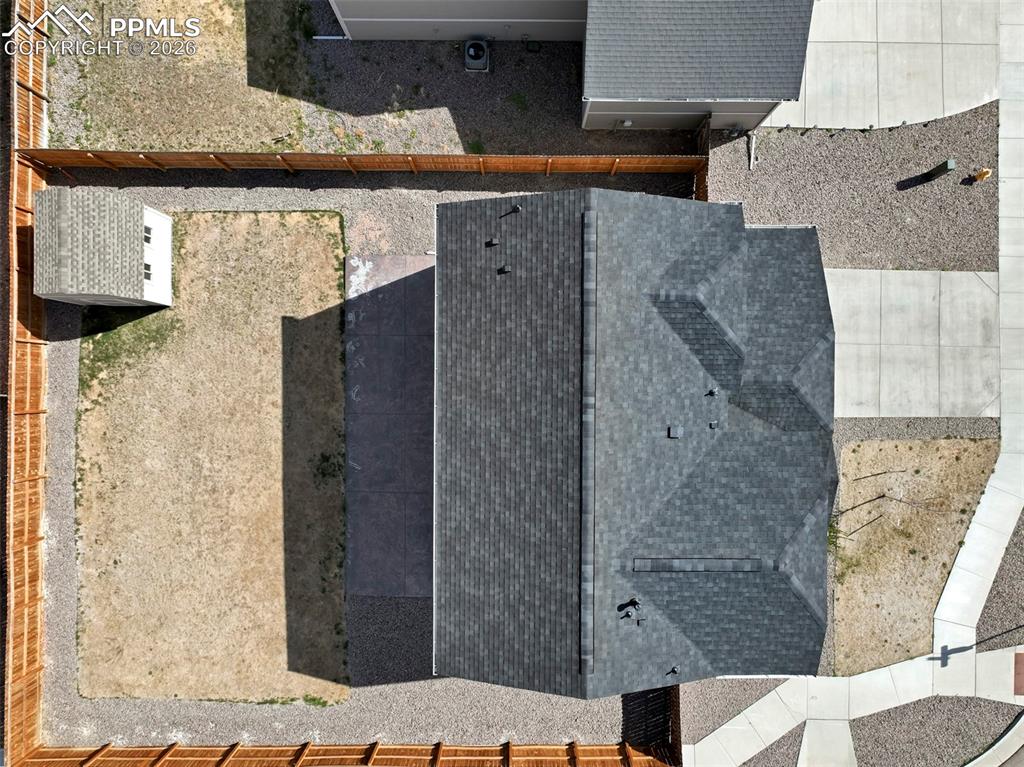 Image 43 of 46: Single-family residence with an asphalt shingle roof and a concrete drivewa