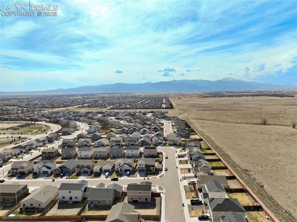 Image 45 of 46: Expansive residential community with established streets and varied home de