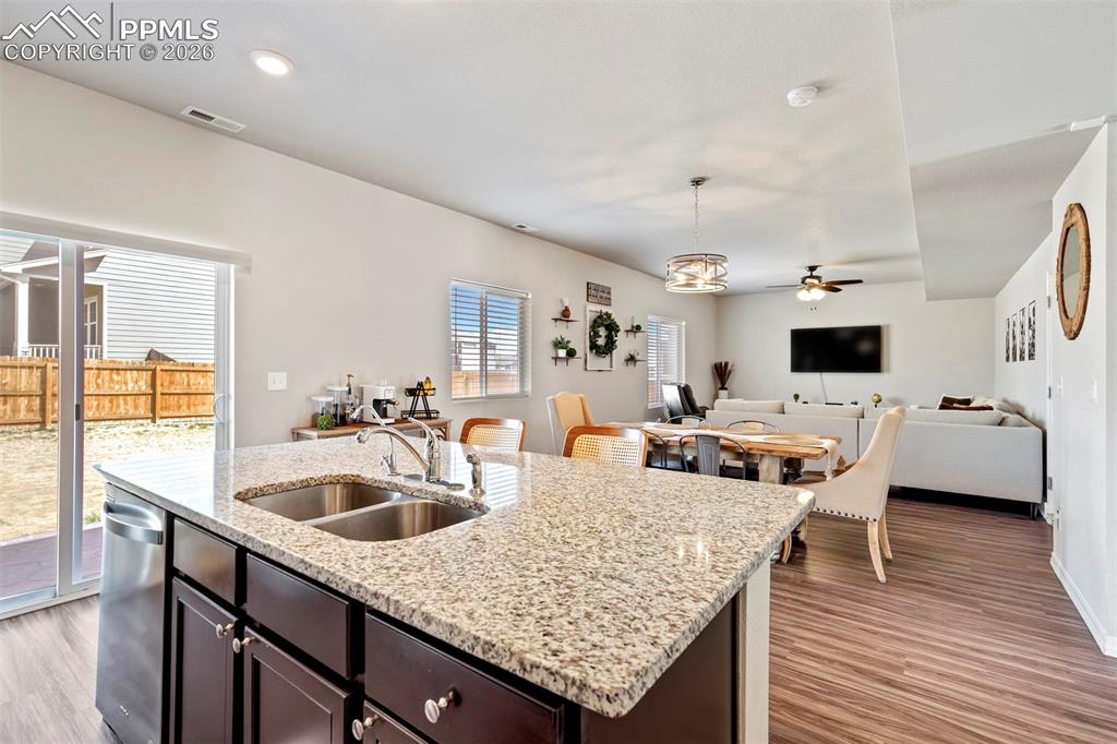 Image 7 of 46: Kitchen island featuring a dual basin stainless steel sink, stainless steel