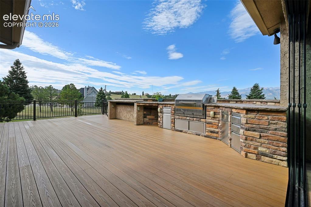 Image 11 of 50: Expansive outdoor deck for entertaining