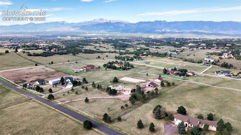 Image 3 of 50: Sweeping Panoramic views of Pikes Peak and Front Range, 2 Barns, Pasture, a